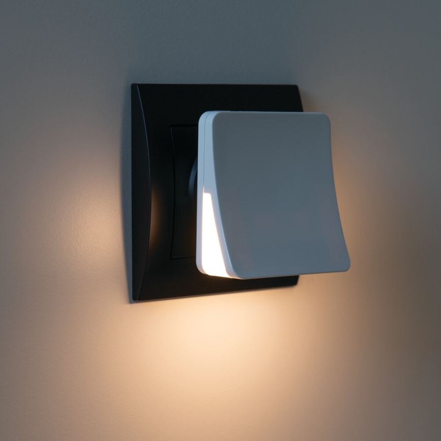 LED orientacijska svetilka s senzorjem mraka za vtičnico HOFI LED/0,28W/230V bela