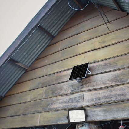 Zatemljiv LED solarni reflektor LED/100W/3,2V 2000-8000K IP65 5000 mAh črna + daljinski upravljalnik