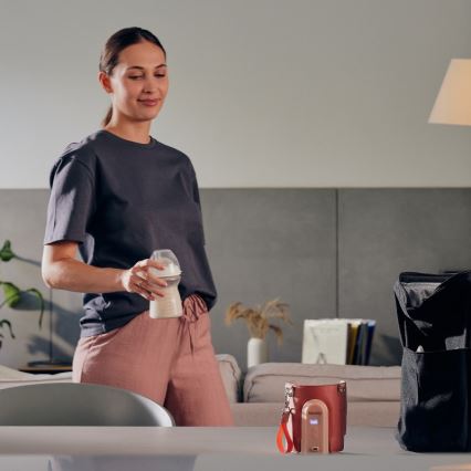 Lionelo - Polnilni grelnik za stekleničke THERMUP GO EVO 18W/5V roza