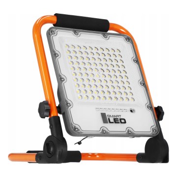Polnilni LED reflektor s stojalom LED/50W/3,2V 4500K 10000 mAh IP65 oranžen
