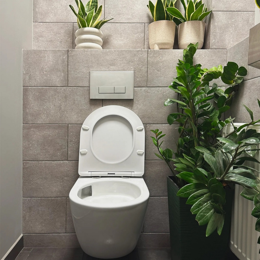 REA-C1259 - Viseča WC školjka z sedežno desko CARLO MINI TORNADO brez obroča keramika/sijajna bela