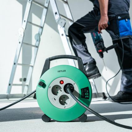 Retlux - Kolutni podaljšek z 3 vtičnicami, tip E, 10 m, zelena/črna