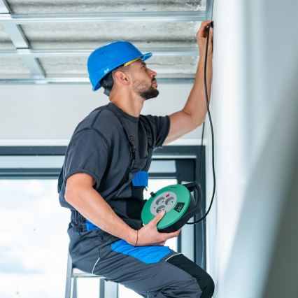 Retlux - Kolutni podaljšek z 3 vtičnicami, tip E, 10 m, zelena/črna