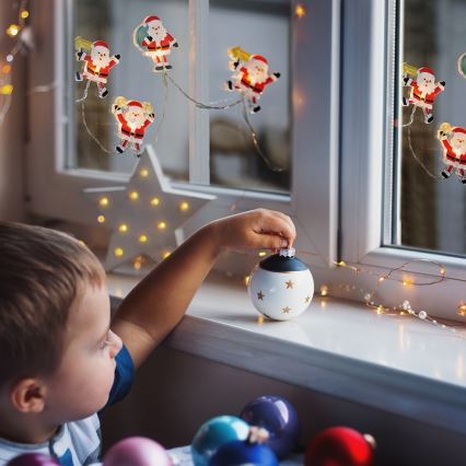 LED božični niz s priseskami 6xLED/2xAA 1,2m topla bela santa