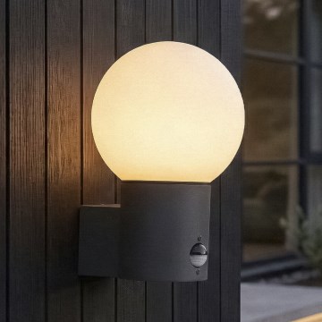 Zunanja stenska svetilka s senzorjem gibanja in senzorjem mraka STONO 1xE27/15W/230V IP65 antracit